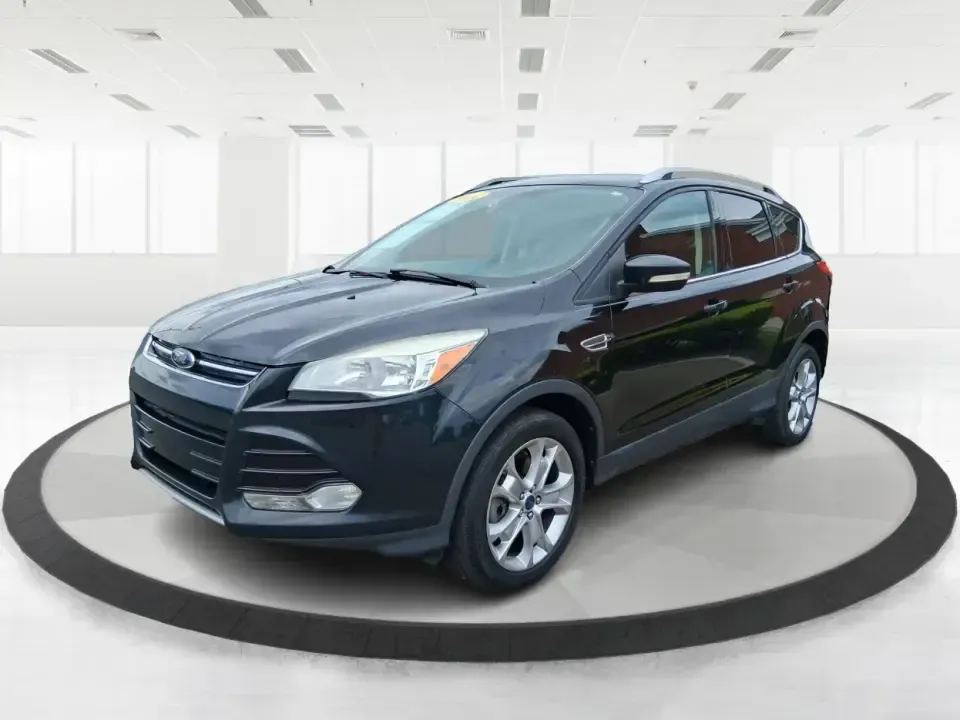 2014 Ford Escape Titanium (1FMCU9J99EU) with an 2.0L L4 DOHC 16V engine, 6-Speed Automatic transmission, located at 1099 N County Rd 25A, Troy, OH, 45373, (937) 908-9800, 40.057079, -84.212883 - Need one SUV that can handle an Ohio winter commute, school drop-offs, and a spontaneous weekend road trip to Hocking Hills without feeling like a compromise? This 2014 Ford Escape Titanium 4WD in sleek Tuxedo Black is built for real life in Troy-comfortable for long drives, confident in bad weather - Photo#8