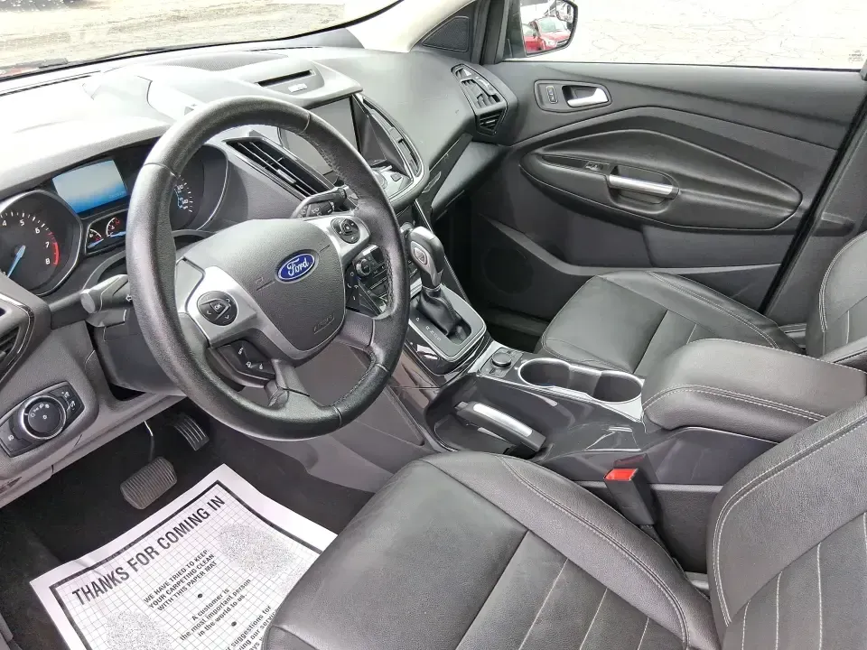 2014 Ford Escape Titanium (1FMCU9J99EU) with an 2.0L L4 DOHC 16V engine, 6-Speed Automatic transmission, located at 1099 N County Rd 25A, Troy, OH, 45373, (937) 908-9800, 40.057079, -84.212883 - Need one SUV that can handle an Ohio winter commute, school drop-offs, and a spontaneous weekend road trip to Hocking Hills without feeling like a compromise? This 2014 Ford Escape Titanium 4WD in sleek Tuxedo Black is built for real life in Troy-comfortable for long drives, confident in bad weather - Photo#9