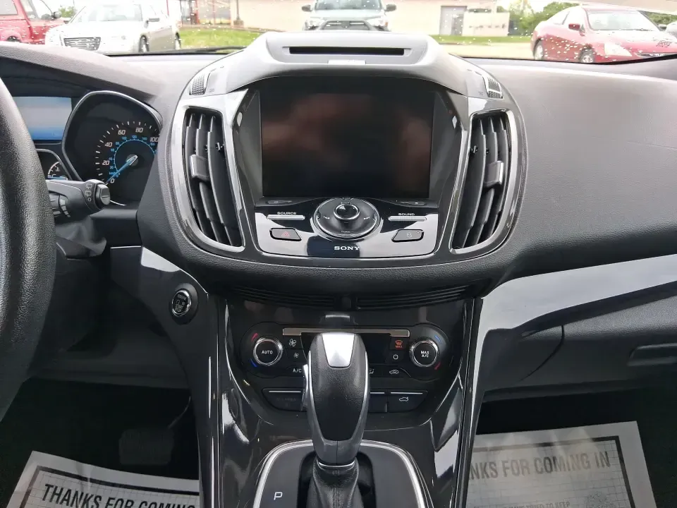 2014 Ford Escape Titanium (1FMCU9J99EU) with an 2.0L L4 DOHC 16V engine, 6-Speed Automatic transmission, located at 1099 N County Rd 25A, Troy, OH, 45373, (937) 908-9800, 40.057079, -84.212883 - Need one SUV that can handle an Ohio winter commute, school drop-offs, and a spontaneous weekend road trip to Hocking Hills without feeling like a compromise? This 2014 Ford Escape Titanium 4WD in sleek Tuxedo Black is built for real life in Troy-comfortable for long drives, confident in bad weather - Photo#13