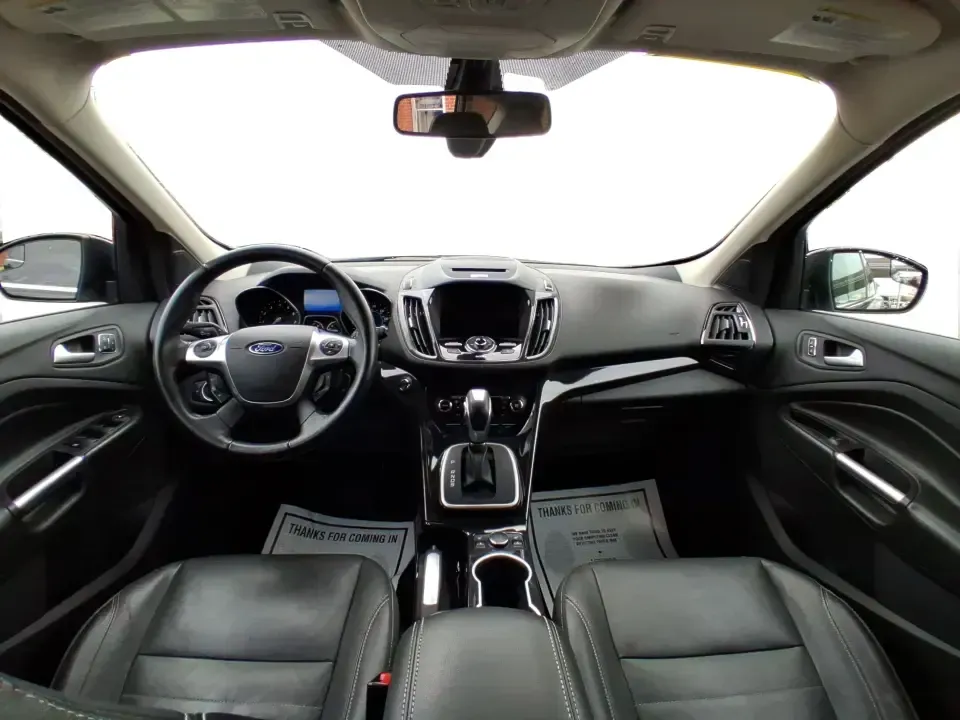 2014 Ford Escape Titanium (1FMCU9J99EU) with an 2.0L L4 DOHC 16V engine, 6-Speed Automatic transmission, located at 1099 N County Rd 25A, Troy, OH, 45373, (937) 908-9800, 40.057079, -84.212883 - Need one SUV that can handle an Ohio winter commute, school drop-offs, and a spontaneous weekend road trip to Hocking Hills without feeling like a compromise? This 2014 Ford Escape Titanium 4WD in sleek Tuxedo Black is built for real life in Troy-comfortable for long drives, confident in bad weather - Photo#21