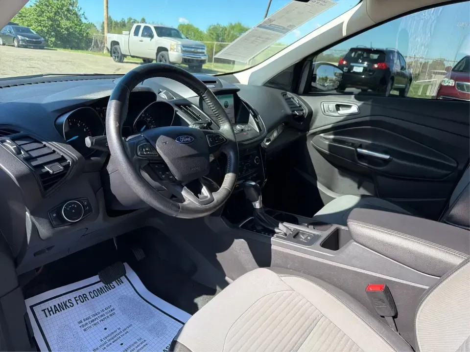 2017 Ford Escape SE (1FMCU0GD2HU) with an 1.5L L4 DOHC 16V engine, 6A transmission, located at 8750 N County Rd 25A, Piqua, OH, 45356, (937) 908-9800, 40.164391, -84.232513 - Picture a weekday that starts with a smooth commute up N County Rd 25A, turns into easy school drop-offs, and ends with a weekend escape to Indian Lake or a quick run down I75 for shopping and dinner-this 2017 Ford Escape SE is built for real life in and around Piqua, Ohio. Finished in standout Whit - Photo#9