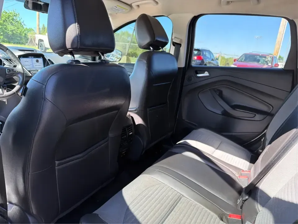 2017 Ford Escape SE (1FMCU0GD2HU) with an 1.5L L4 DOHC 16V engine, 6A transmission, located at 8750 N County Rd 25A, Piqua, OH, 45356, (937) 908-9800, 40.164391, -84.232513 - Picture a weekday that starts with a smooth commute up N County Rd 25A, turns into easy school drop-offs, and ends with a weekend escape to Indian Lake or a quick run down I75 for shopping and dinner-this 2017 Ford Escape SE is built for real life in and around Piqua, Ohio. Finished in standout Whit - Photo#10