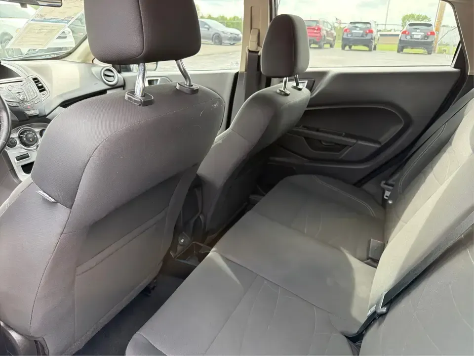 2016 Ford Fiesta SE (3FADP4EJ8GM) with an 1.6L L4 DOHC 16V engine, located at 8750 N County Rd 25A, Piqua, OH, 45356, (937) 908-9800, 40.164391, -84.232513 - Need a smart, easy-to-park hatchback that makes daily life simpler-whether you're commuting up I-75, running errands around downtown Piqua, or packing up for a weekend at Lock 9 Park? This 2016 Ford Fiesta SE Hatchback in Shadow Black delivers big practicality in a small, budget-friendly footprint, - Photo#10