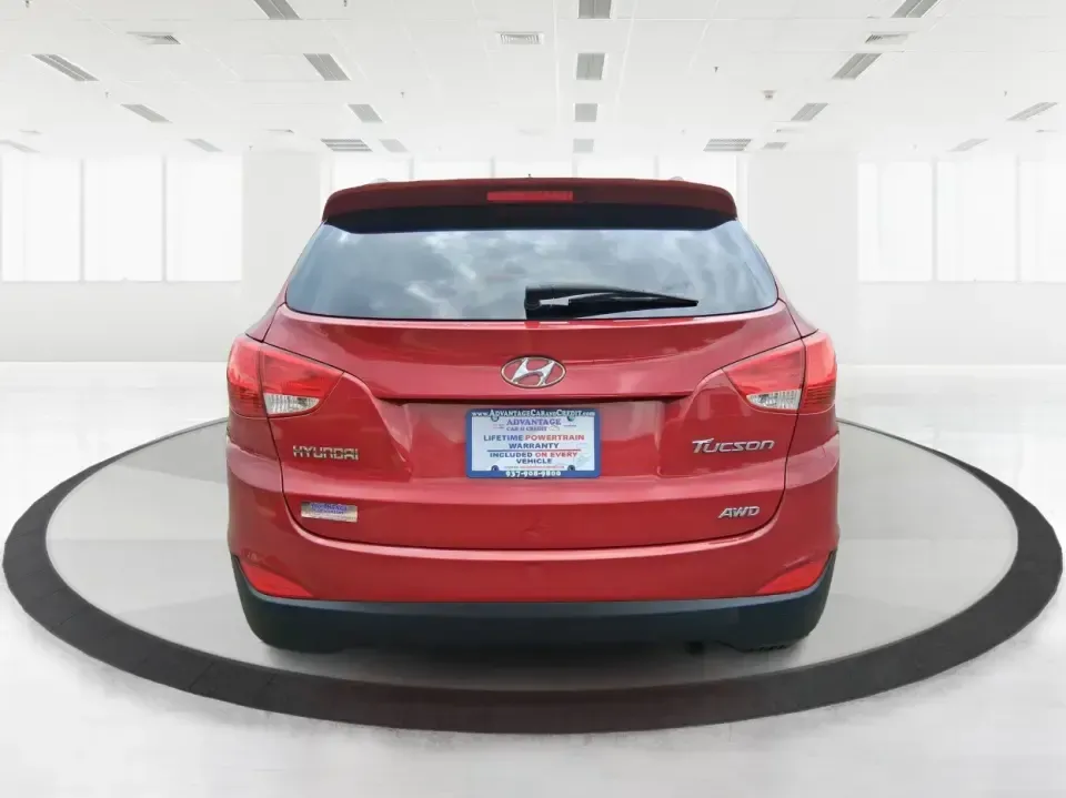 2013 Hyundai Tucson GLS (KM8JUCAC7DU) with an Theta II 2.4L I-4 DOHC engine, 6-Speed Automatic transmission, located at 1951 S Dayton Lakeview Rd., New Carlisle, OH, 45344, (937) 908-9800, 39.890999, -84.050255 - Need a dependable SUV that can handle Ohio weather, school drop-offs, and weekend getaways without stretching your budget? This 2013 Hyundai Tucson GLS in eye-catching Garnet Red is built for real life-comfortable for daily commuting, confident on slick winter roads, and practical for everything fro - Photo#3