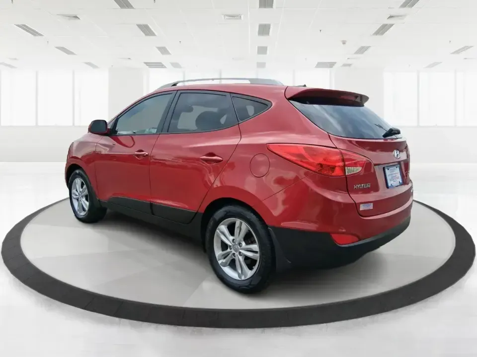 2013 Hyundai Tucson GLS (KM8JUCAC7DU) with an Theta II 2.4L I-4 DOHC engine, 6-Speed Automatic transmission, located at 1951 S Dayton Lakeview Rd., New Carlisle, OH, 45344, (937) 908-9800, 39.890999, -84.050255 - Need a dependable SUV that can handle Ohio weather, school drop-offs, and weekend getaways without stretching your budget? This 2013 Hyundai Tucson GLS in eye-catching Garnet Red is built for real life-comfortable for daily commuting, confident on slick winter roads, and practical for everything fro - Photo#4