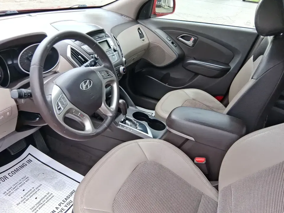 2013 Hyundai Tucson GLS (KM8JUCAC7DU) with an Theta II 2.4L I-4 DOHC engine, 6-Speed Automatic transmission, located at 1951 S Dayton Lakeview Rd., New Carlisle, OH, 45344, (937) 908-9800, 39.890999, -84.050255 - Need a dependable SUV that can handle Ohio weather, school drop-offs, and weekend getaways without stretching your budget? This 2013 Hyundai Tucson GLS in eye-catching Garnet Red is built for real life-comfortable for daily commuting, confident on slick winter roads, and practical for everything fro - Photo#9