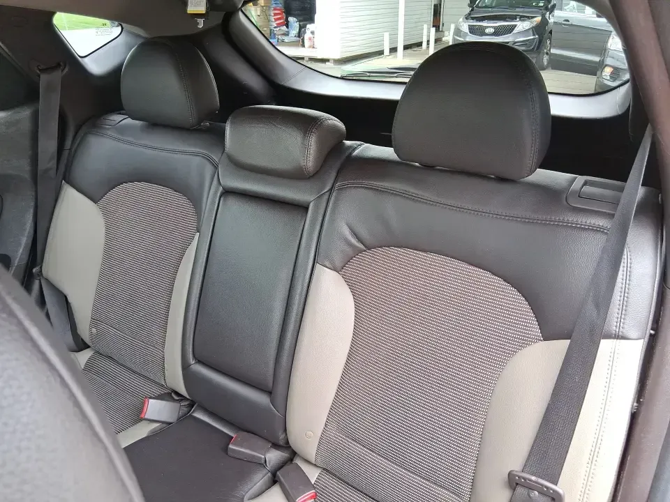 2013 Hyundai Tucson GLS (KM8JUCAC7DU) with an Theta II 2.4L I-4 DOHC engine, 6-Speed Automatic transmission, located at 1951 S Dayton Lakeview Rd., New Carlisle, OH, 45344, (937) 908-9800, 39.890999, -84.050255 - Need a dependable SUV that can handle Ohio weather, school drop-offs, and weekend getaways without stretching your budget? This 2013 Hyundai Tucson GLS in eye-catching Garnet Red is built for real life-comfortable for daily commuting, confident on slick winter roads, and practical for everything fro - Photo#10