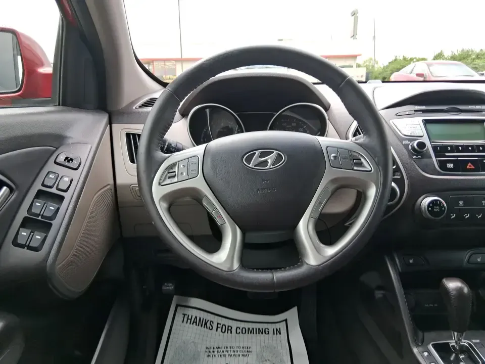 2013 Hyundai Tucson GLS (KM8JUCAC7DU) with an Theta II 2.4L I-4 DOHC engine, 6-Speed Automatic transmission, located at 1951 S Dayton Lakeview Rd., New Carlisle, OH, 45344, (937) 908-9800, 39.890999, -84.050255 - Need a dependable SUV that can handle Ohio weather, school drop-offs, and weekend getaways without stretching your budget? This 2013 Hyundai Tucson GLS in eye-catching Garnet Red is built for real life-comfortable for daily commuting, confident on slick winter roads, and practical for everything fro - Photo#16