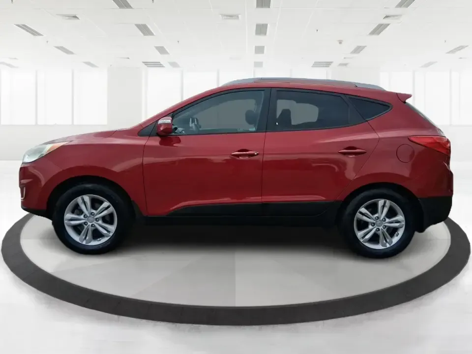 2013 Hyundai Tucson GLS (KM8JUCAC7DU) with an Theta II 2.4L I-4 DOHC engine, 6-Speed Automatic transmission, located at 8750 N County Rd 25A, Piqua, OH, 45356, (937) 908-9800, 40.164391, -84.232513 - Need a dependable SUV that can handle Ohio weather, school drop-offs, and weekend getaways without stretching your budget? This 2013 Hyundai Tucson GLS in eye-catching Garnet Red is built for real life-comfortable for daily commuting, confident on slick winter roads, and practical for everything fro - Photo#5