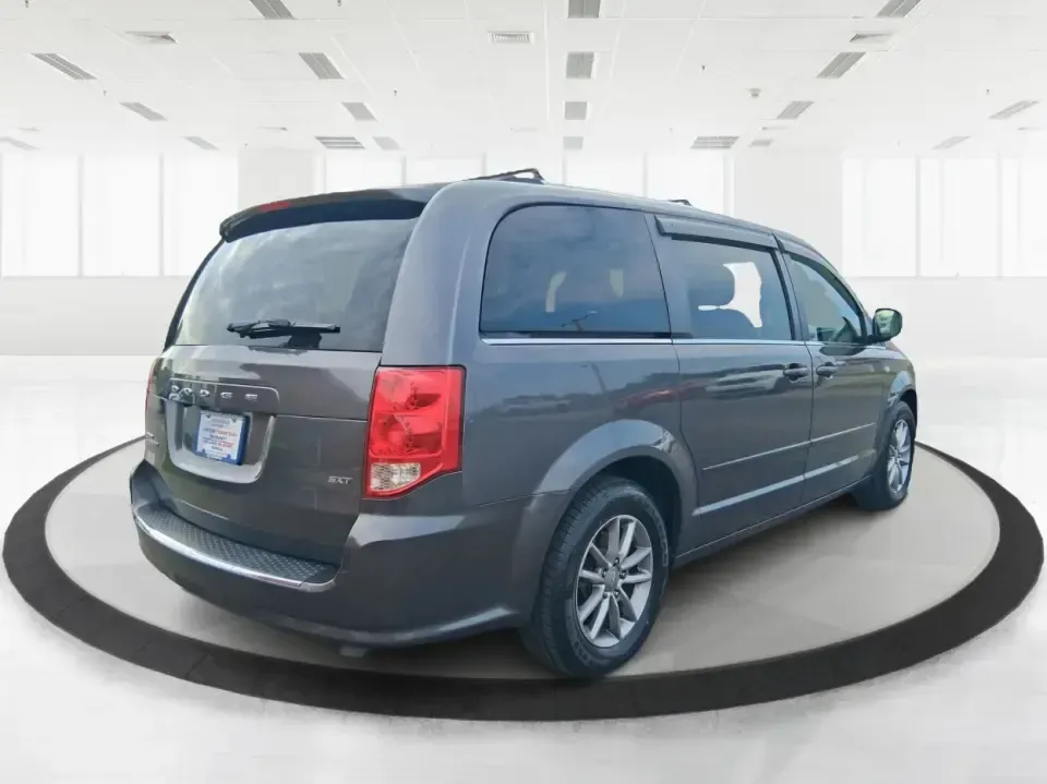 2014 Dodge Grand Caravan SXT 30th Anniversary (2C4RDGCGXER) with an 3.6L V-6 DOHC engine, 6-Speed Automatic transmission, located at 1951 S Dayton Lakeview Rd., New Carlisle, OH, 45344, (937) 908-9800, 39.890999, -84.050255 - Load up the kids, the coolers, and the weekend plans-this 2014 Dodge Grand Caravan SXT 30th Anniversary is built for real life in Ohio, whether you're handling school drop-offs, commuting down I70, or taking a road trip to the National Museum of the U.S. Air Force in nearby Dayton. With three rows a - Photo#2