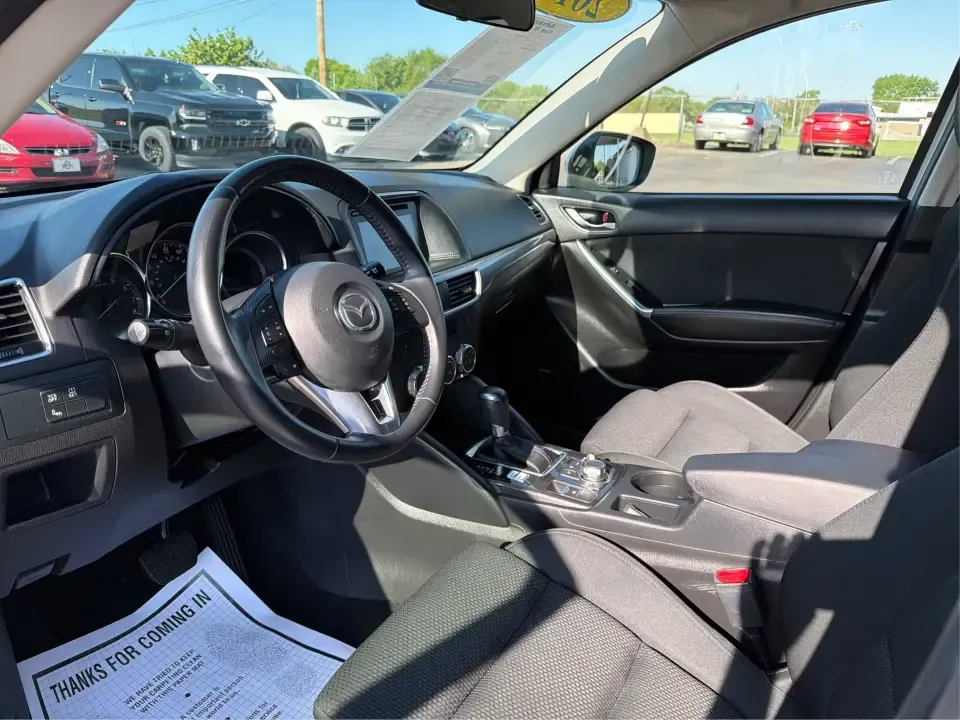 2016 Mazda CX-5 Touring (JM3KE4CYXG0) with an SKYACTIV-G 2.5L I-4 gasoline direct injection engine, 6-Speed Automatic transmission, located at 1230 East Main St, Xenia, OH, 45385, (937) 908-9800, 39.688026, -83.910172 - Pack up the kids, load the groceries, or point the nose toward a weekend road trip-this 2016 Mazda CX-5 Touring is the kind of SUV that fits real life in Piqua. With confident all-weather capability and a comfortable, well-equipped cabin, it's a smart choice for commuters running up and down I75, fa - Photo#9