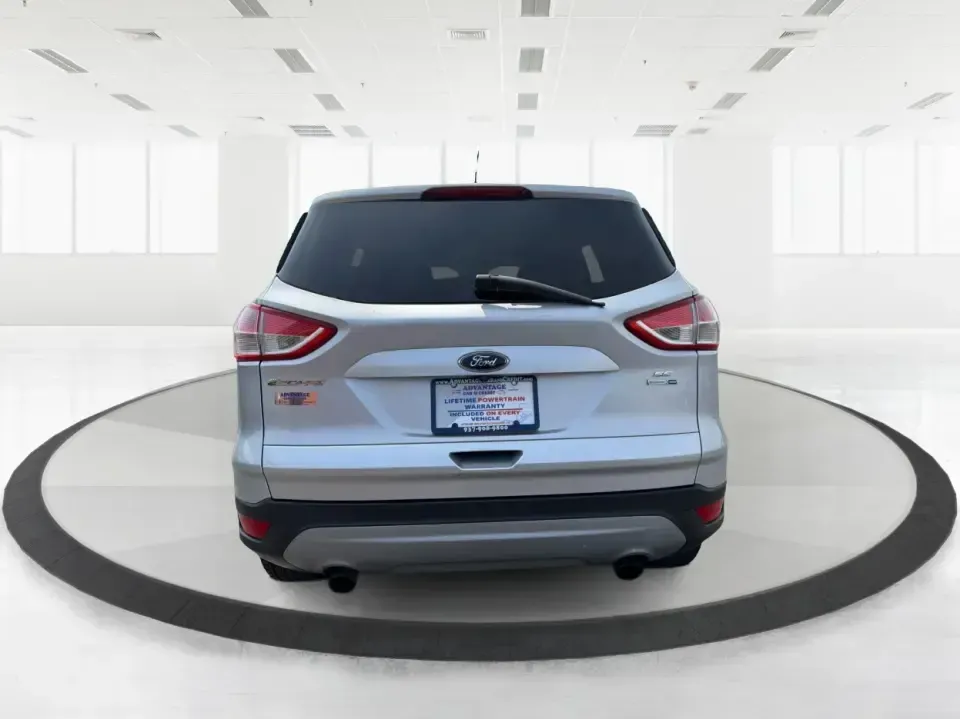 2015 Ford Escape SE (1FMCU9G98FU) with an 2.0L L4 DOHC 16V engine, 6-Speed Automatic transmission, located at 1099 N County Rd 25A, Troy, OH, 45373, (937) 908-9800, 40.057079, -84.212883 - Weekday commutes down I75, school drop-offs around Troy City Schools, and spontaneous weekend trips to Charleston Falls Preserve all get easier when you have an SUV that's the right size, the right power, and the right fit for your budget. This 2015 Ford Escape SE in Ingot Silver is built for real-l - Photo#3