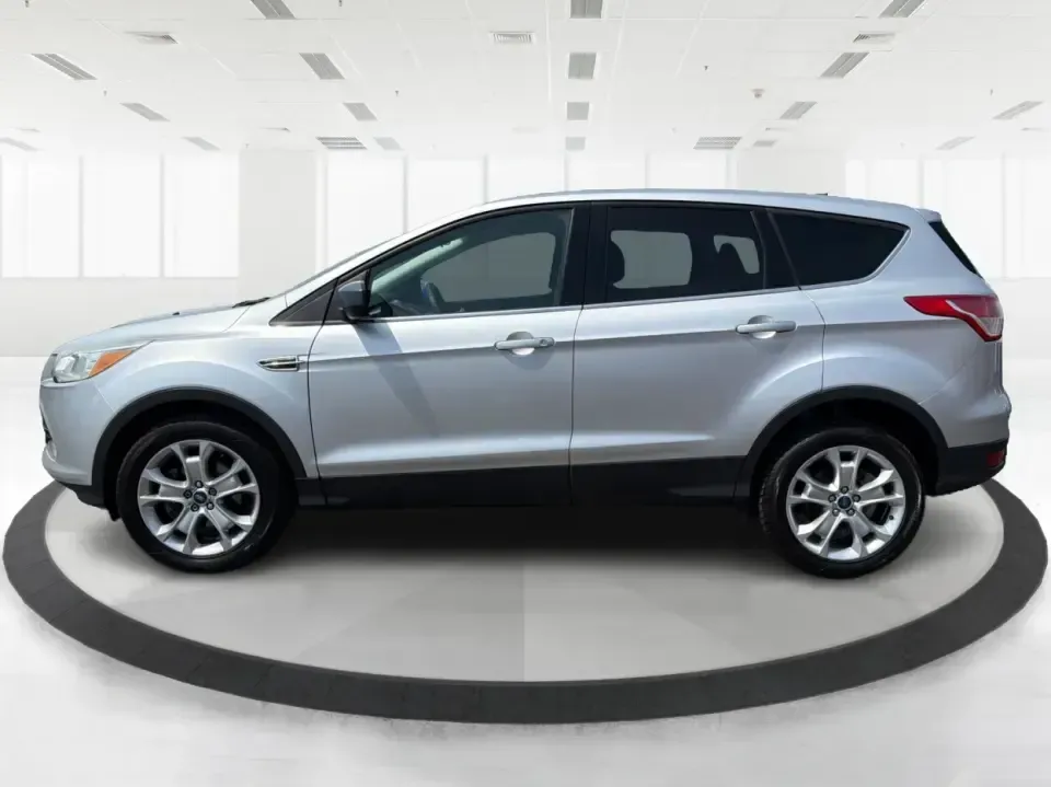 2015 Ford Escape SE (1FMCU9G98FU) with an 2.0L L4 DOHC 16V engine, 6-Speed Automatic transmission, located at 1099 N County Rd 25A, Troy, OH, 45373, (937) 908-9800, 40.057079, -84.212883 - Weekday commutes down I75, school drop-offs around Troy City Schools, and spontaneous weekend trips to Charleston Falls Preserve all get easier when you have an SUV that's the right size, the right power, and the right fit for your budget. This 2015 Ford Escape SE in Ingot Silver is built for real-l - Photo#5