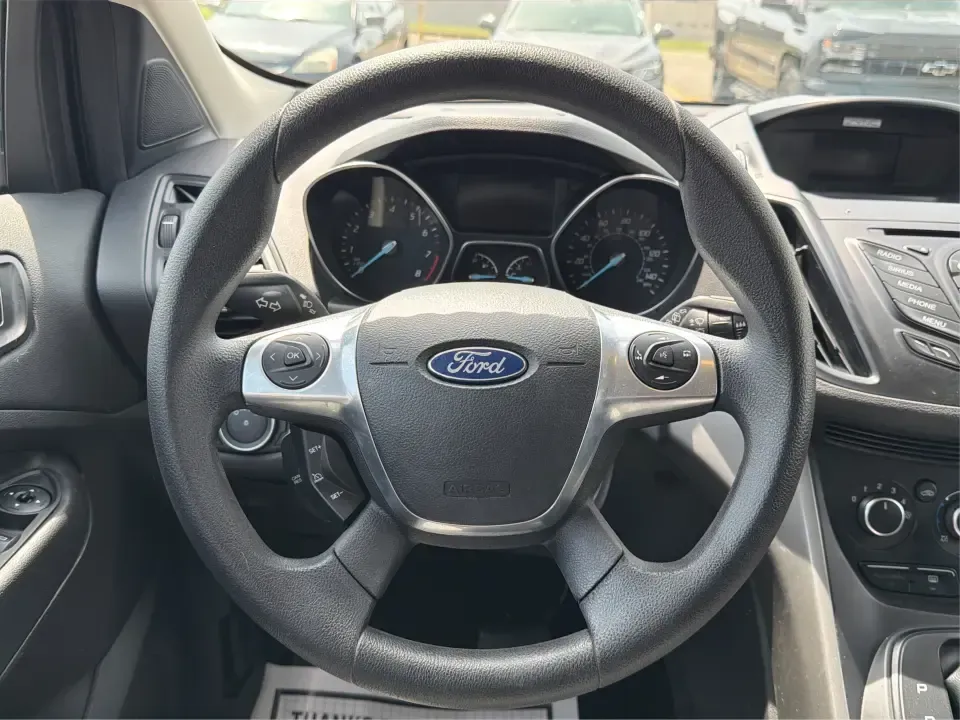 2015 Ford Escape SE (1FMCU9G98FU) with an 2.0L L4 DOHC 16V engine, 6-Speed Automatic transmission, located at 1099 N County Rd 25A, Troy, OH, 45373, (937) 908-9800, 40.057079, -84.212883 - Weekday commutes down I75, school drop-offs around Troy City Schools, and spontaneous weekend trips to Charleston Falls Preserve all get easier when you have an SUV that's the right size, the right power, and the right fit for your budget. This 2015 Ford Escape SE in Ingot Silver is built for real-l - Photo#16