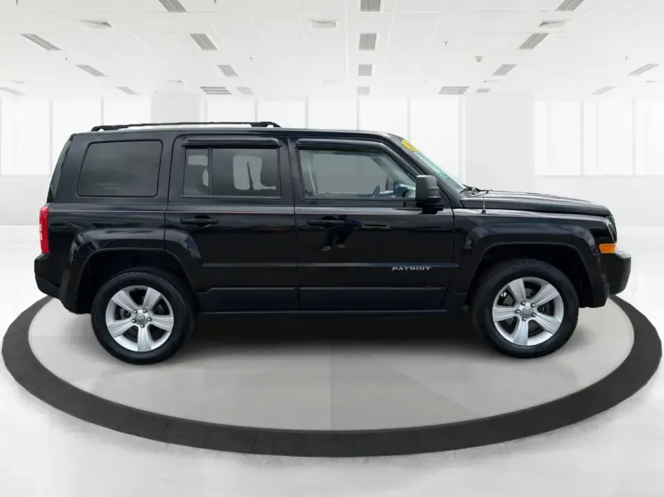 2014 Jeep Patriot Latitude 4WD (1C4NJRFB4ED) with an 2.4L L4 DOHC 16V engine, located at 1099 N County Rd 25A, Troy, OH, 45373, (937) 908-9800, 40.057079, -84.212883 - Weekend plans, winter commutes, school drop-offs, and last-minute road trips all get easier when you've got an SUV that fits real life. This **2014 Jeep Patriot Latitude 4WD** in **Black Clearcoat** is a practical choice for drivers who want confident traction, a comfortable cabin for five, and the- Photo#1