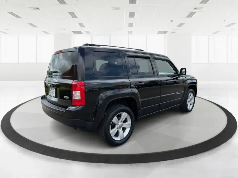 2014 Jeep Patriot Latitude 4WD (1C4NJRFB4ED) with an 2.4L L4 DOHC 16V engine, located at 1099 N County Rd 25A, Troy, OH, 45373, (937) 908-9800, 40.057079, -84.212883 - Weekend plans, winter commutes, school drop-offs, and last-minute road trips all get easier when you've got an SUV that fits real life. This **2014 Jeep Patriot Latitude 4WD** in **Black Clearcoat** is a practical choice for drivers who want confident traction, a comfortable cabin for five, and the- Photo#2