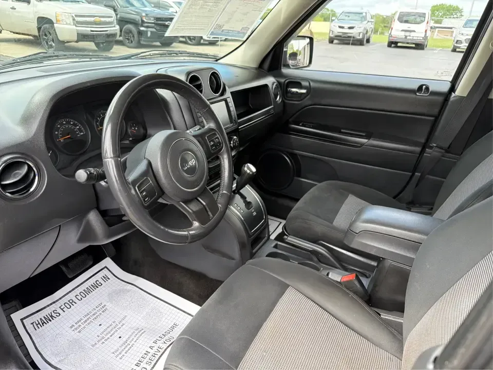 2014 Jeep Patriot Latitude 4WD (1C4NJRFB4ED) with an 2.4L L4 DOHC 16V engine, located at 1099 N County Rd 25A, Troy, OH, 45373, (937) 908-9800, 40.057079, -84.212883 - Weekend plans, winter commutes, school drop-offs, and last-minute road trips all get easier when you've got an SUV that fits real life. This **2014 Jeep Patriot Latitude 4WD** in **Black Clearcoat** is a practical choice for drivers who want confident traction, a comfortable cabin for five, and the- Photo#9