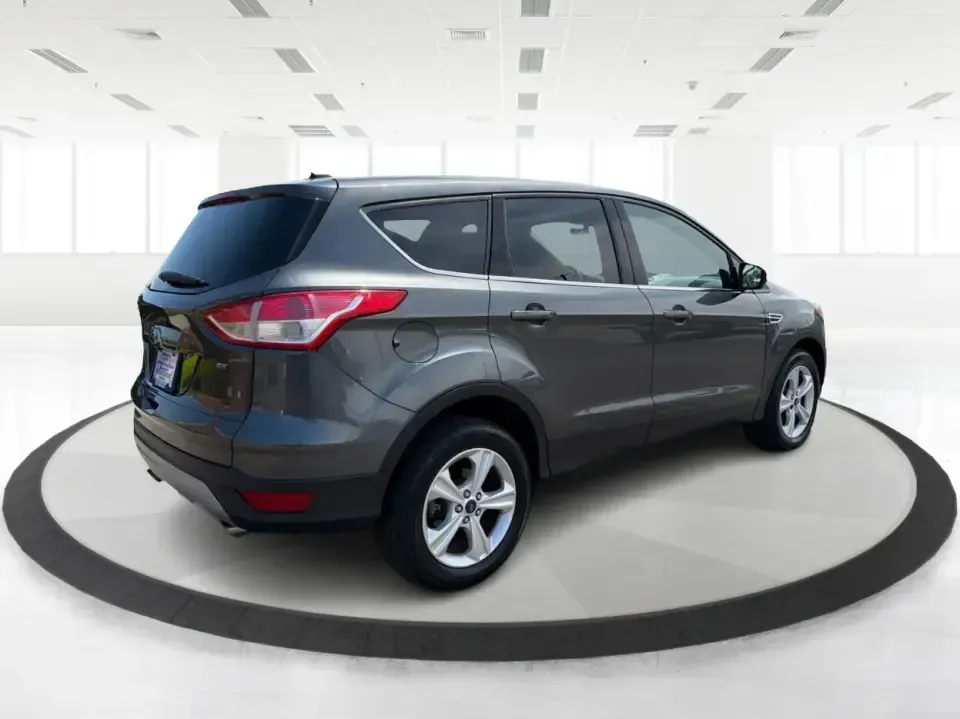 2016 Ford Escape SE (1FMCU0G77GU) with an 2.5L L4 DOHC 16V engine, 6-Speed Automatic transmission, located at 4508 South Dixie Dr, Moraine, OH, 45439, (937) 908-9800, 39.689976, -84.218452 - Whether you're commuting up and down South Dixie Drive, running errands between Moraine and Dayton, or packing up for a weekend getaway, this 2016 Ford Escape SE is the kind of practical SUV that fits real life. It's easy to park, comfortable for daily driving, and versatile enough for everything fr - Photo#2