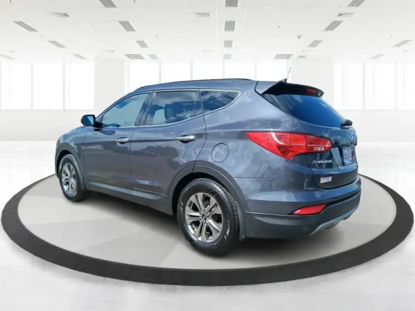 2015 Hyundai Santa Fe 2.4L (5XYZUDLB3FG) with an Theta II 2.4L I-4 gasoline direct injection engine, 6-Speed Automatic transmission, located at 1230 East Main St, Xenia, OH, 45385, (937) 908-9800, 39.688026, -83.910172 - Pack up the kids, load the cooler, and point your weekend plans toward the open road-this 2015 Hyundai Santa Fe 2.4L in Platinum Graphite is the kind of SUV that fits real life in Riverside. Whether you're commuting down I-75, running errands along Woodman Dr, or heading out for a day at Eastwood Me - Photo#4