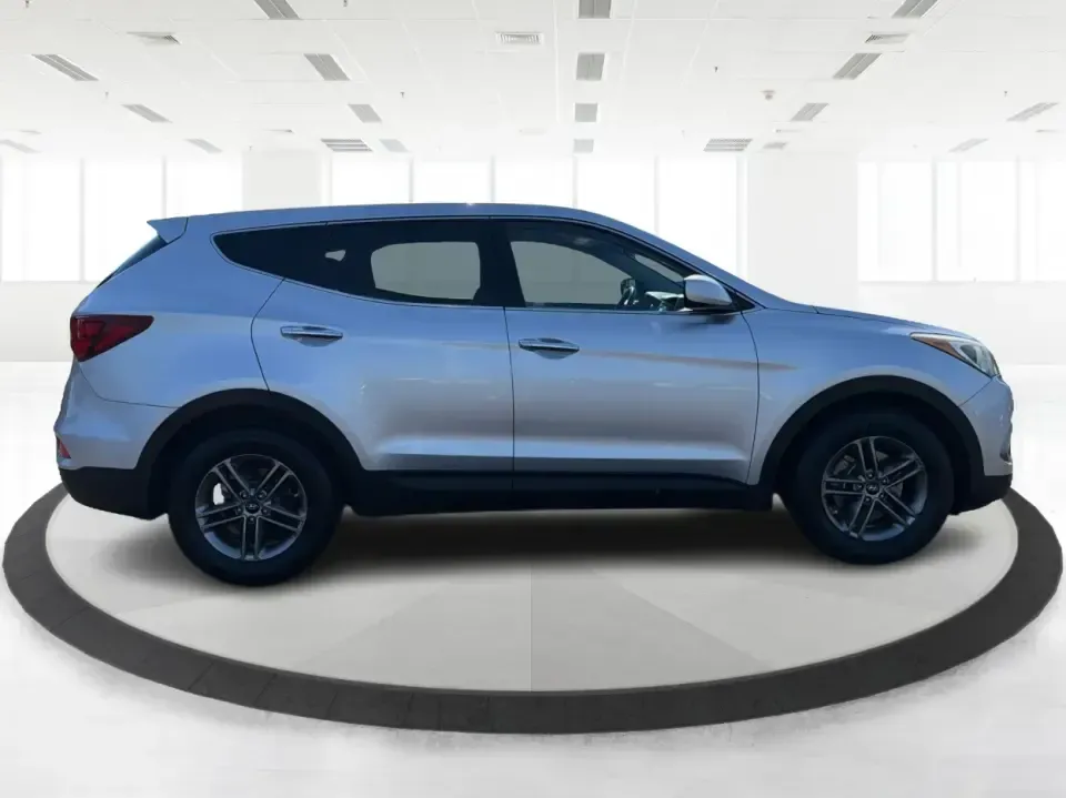 2017 Hyundai Santa Fe 2.4L (5XYZT3LB8HG) with an Theta II 2.4L I-4 gasoline direct injection engine, 6A transmission, located at 8750 N County Rd 25A, Piqua, OH, 45356, (937) 908-9800, 40.164391, -84.232513 - Load up the family, point the GPS toward a weekend getaway, and enjoy the confidence of an SUV that's built for everyday life in Ohio-this **2017 Hyundai Santa Fe 2.4L** is a smart pick for commuting, school runs, and road trips alike. Finished in **Sparkling Silver**, it brings the practical space - Photo#1