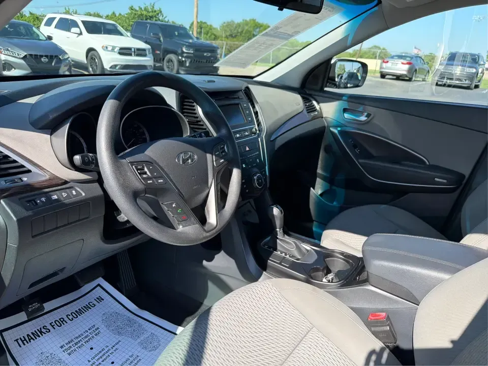 2017 Hyundai Santa Fe 2.4L (5XYZT3LB8HG) with an Theta II 2.4L I-4 gasoline direct injection engine, 6A transmission, located at 8750 N County Rd 25A, Piqua, OH, 45356, (937) 908-9800, 40.164391, -84.232513 - Load up the family, point the GPS toward a weekend getaway, and enjoy the confidence of an SUV that's built for everyday life in Ohio-this **2017 Hyundai Santa Fe 2.4L** is a smart pick for commuting, school runs, and road trips alike. Finished in **Sparkling Silver**, it brings the practical space - Photo#9