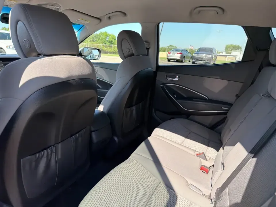 2017 Hyundai Santa Fe 2.4L (5XYZT3LB8HG) with an Theta II 2.4L I-4 gasoline direct injection engine, 6A transmission, located at 8750 N County Rd 25A, Piqua, OH, 45356, (937) 908-9800, 40.164391, -84.232513 - Load up the family, point the GPS toward a weekend getaway, and enjoy the confidence of an SUV that's built for everyday life in Ohio-this **2017 Hyundai Santa Fe 2.4L** is a smart pick for commuting, school runs, and road trips alike. Finished in **Sparkling Silver**, it brings the practical space - Photo#10