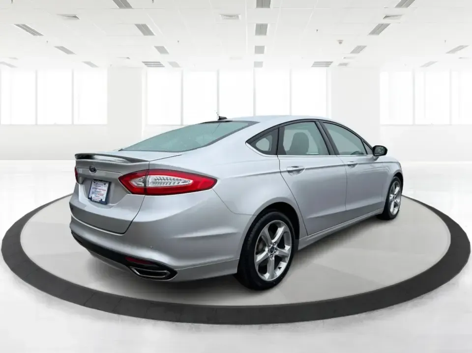 2014 Ford Fusion SE (3FA6P0H90ER) with an 2.0L L4 DOHC 16V engine, located at 1951 S Dayton Lakeview Rd., New Carlisle, OH, 45344, (937) 908-9800, 39.890999, -84.050255 - Need a smart, comfortable sedan for the daily drive from New Carlisle to Dayton, Wright-Patterson AFB, or Springfield-plus something that's still enjoyable for weekend trips to Buck Creek or an evening out near The Greene? This 2014 Ford Fusion SE blends commuter-friendly efficiency with upscale fea - Photo#2