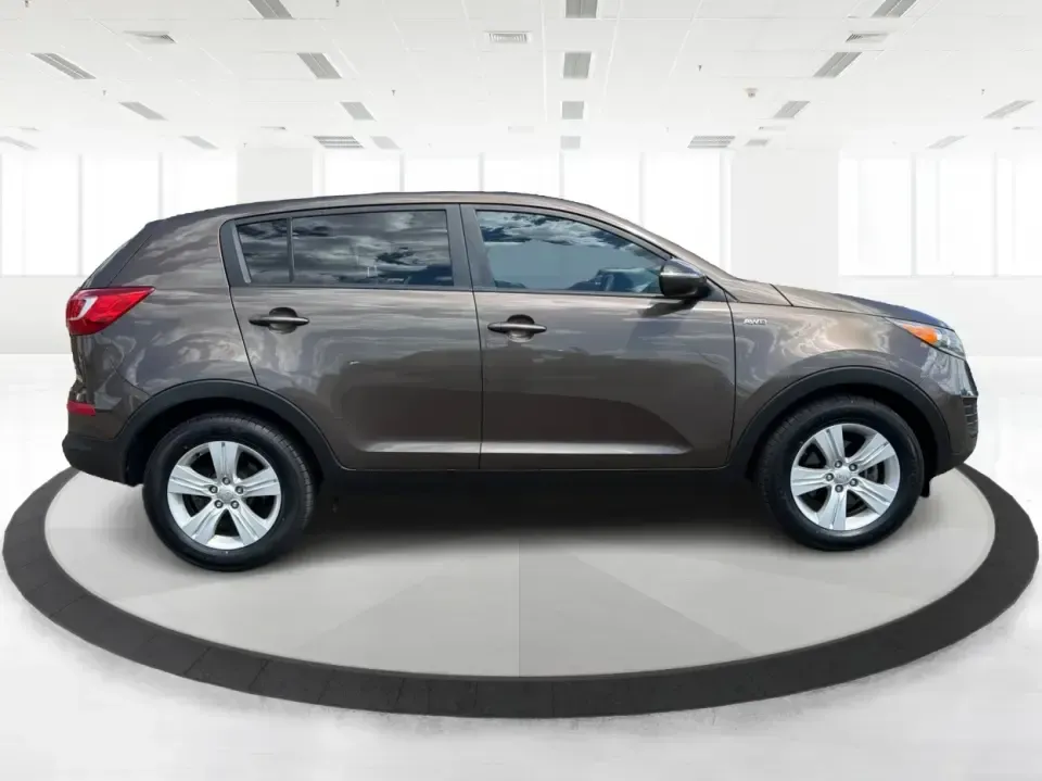 2013 Kia Sportage LX (KNDPBCA27D7) with an 2.4L I-4 DOHC engine, 6-Speed Automatic transmission, located at 1099 N County Rd 25A, Troy, OH, 45373, (937) 908-9800, 40.057079, -84.212883 - Pack up for a weekend at Troy Community Park, tackle a snowy school run, or cruise I75 for your daily commute-this 2013 Kia Sportage LX is the kind of compact SUV that fits real life in West Central Ohio. With its versatile crossover size, confident AWD capability, and practical cargo space, it's a - Photo#1