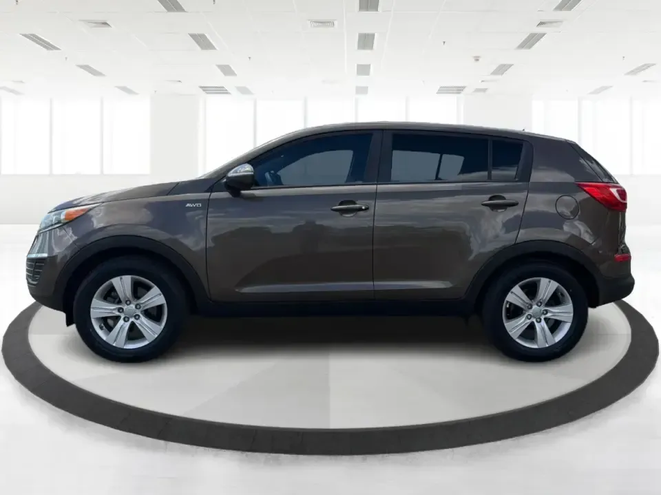 2013 Kia Sportage LX (KNDPBCA27D7) with an 2.4L I-4 DOHC engine, 6-Speed Automatic transmission, located at 1099 N County Rd 25A, Troy, OH, 45373, (937) 908-9800, 40.057079, -84.212883 - Pack up for a weekend at Troy Community Park, tackle a snowy school run, or cruise I75 for your daily commute-this 2013 Kia Sportage LX is the kind of compact SUV that fits real life in West Central Ohio. With its versatile crossover size, confident AWD capability, and practical cargo space, it's a - Photo#5