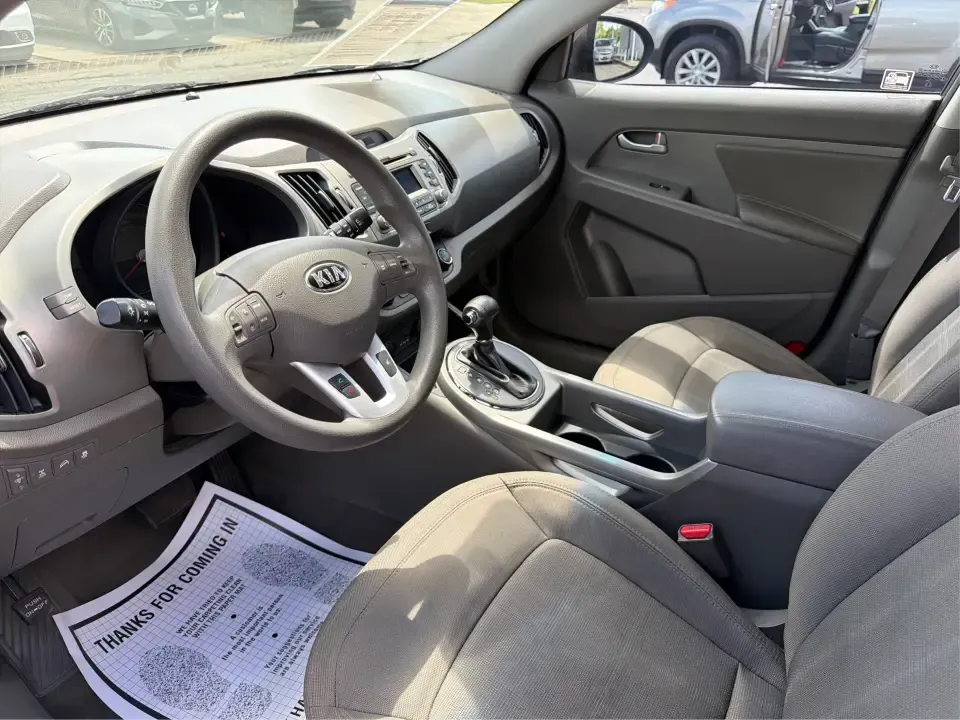 2013 Kia Sportage LX (KNDPBCA27D7) with an 2.4L I-4 DOHC engine, 6-Speed Automatic transmission, located at 1099 N County Rd 25A, Troy, OH, 45373, (937) 908-9800, 40.057079, -84.212883 - Pack up for a weekend at Troy Community Park, tackle a snowy school run, or cruise I75 for your daily commute-this 2013 Kia Sportage LX is the kind of compact SUV that fits real life in West Central Ohio. With its versatile crossover size, confident AWD capability, and practical cargo space, it's a - Photo#9