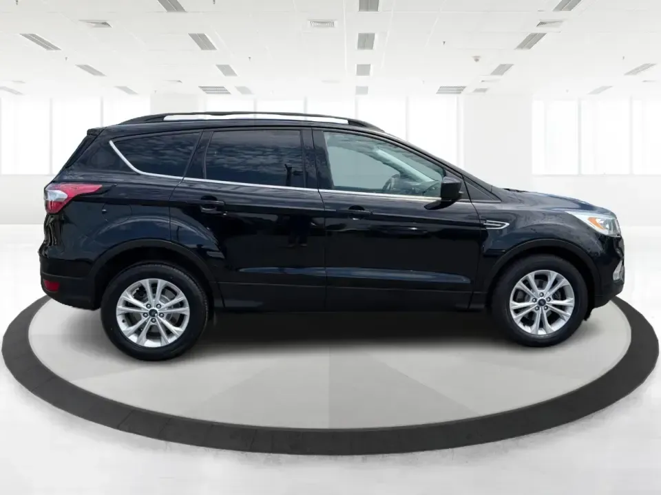 2017 Ford Escape SE (1FMCU0GD1HU) with an 1.5L L4 DOHC 16V engine, 6A transmission, located at 1099 N County Rd 25A, Troy, OH, 45373, (937) 908-9800, 40.057079, -84.212883 - Need a compact SUV that can handle the weekday commute on I75, school drop-offs around Troy, and spontaneous weekend getaways to Charleston Falls Preserve or a quick stroll through the Troy Strawberry Festival? This 2017 Ford Escape SE in Shadow Black is a practical, easy-to-live-with choice for bus - Photo#1