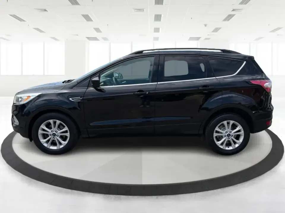 2017 Ford Escape SE (1FMCU0GD1HU) with an 1.5L L4 DOHC 16V engine, 6A transmission, located at 1099 N County Rd 25A, Troy, OH, 45373, (937) 908-9800, 40.057079, -84.212883 - Need a compact SUV that can handle the weekday commute on I75, school drop-offs around Troy, and spontaneous weekend getaways to Charleston Falls Preserve or a quick stroll through the Troy Strawberry Festival? This 2017 Ford Escape SE in Shadow Black is a practical, easy-to-live-with choice for bus - Photo#5