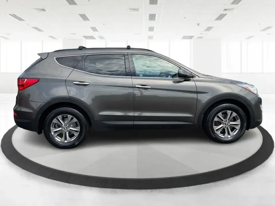 2014 Hyundai Santa Fe Sport 2.4 AWD (5XYZUDLB0EG) with an 2.4L L4 DOHC 16V engine, 6-Speed Automatic transmission, located at 4508 South Dixie Dr, Moraine, OH, 45439, (937) 908-9800, 39.689976, -84.218452 - Picture your next weekend escape: loading up the family, pointing the nose toward the MetroParks, and cruising I-75 with room for everyone and everything-without feeling like you're driving a bus. This 2014 Hyundai Santa Fe 2.4L in Cabo Bronze is a practical, road-trip-ready SUV that fits real life- Photo#1