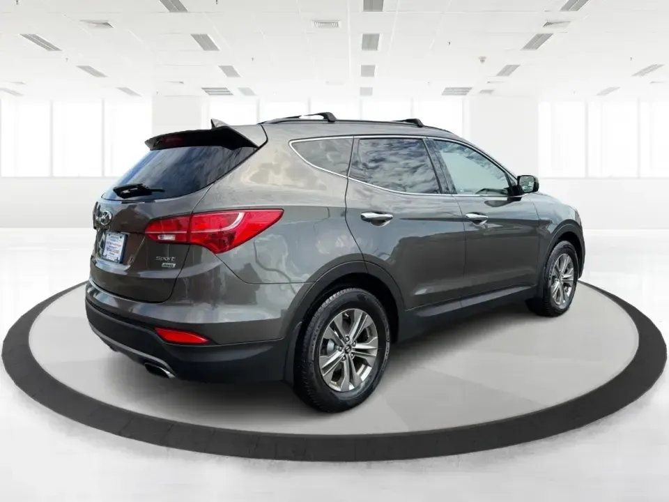 2014 Hyundai Santa Fe Sport 2.4 AWD (5XYZUDLB0EG) with an 2.4L L4 DOHC 16V engine, 6-Speed Automatic transmission, located at 4508 South Dixie Dr, Moraine, OH, 45439, (937) 908-9800, 39.689976, -84.218452 - Picture your next weekend escape: loading up the family, pointing the nose toward the MetroParks, and cruising I-75 with room for everyone and everything-without feeling like you're driving a bus. This 2014 Hyundai Santa Fe 2.4L in Cabo Bronze is a practical, road-trip-ready SUV that fits real life- Photo#2