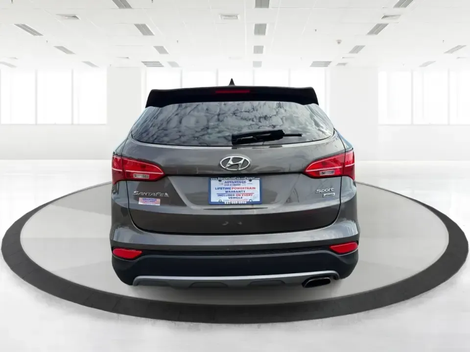 2014 Hyundai Santa Fe Sport 2.4 AWD (5XYZUDLB0EG) with an 2.4L L4 DOHC 16V engine, 6-Speed Automatic transmission, located at 4508 South Dixie Dr, Moraine, OH, 45439, (937) 908-9800, 39.689976, -84.218452 - Picture your next weekend escape: loading up the family, pointing the nose toward the MetroParks, and cruising I-75 with room for everyone and everything-without feeling like you're driving a bus. This 2014 Hyundai Santa Fe 2.4L in Cabo Bronze is a practical, road-trip-ready SUV that fits real life- Photo#3