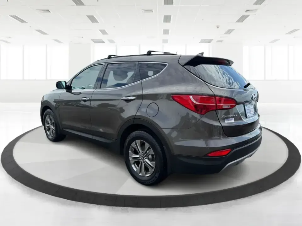 2014 Hyundai Santa Fe Sport 2.4 AWD (5XYZUDLB0EG) with an 2.4L L4 DOHC 16V engine, 6-Speed Automatic transmission, located at 4508 South Dixie Dr, Moraine, OH, 45439, (937) 908-9800, 39.689976, -84.218452 - Picture your next weekend escape: loading up the family, pointing the nose toward the MetroParks, and cruising I-75 with room for everyone and everything-without feeling like you're driving a bus. This 2014 Hyundai Santa Fe 2.4L in Cabo Bronze is a practical, road-trip-ready SUV that fits real life- Photo#4