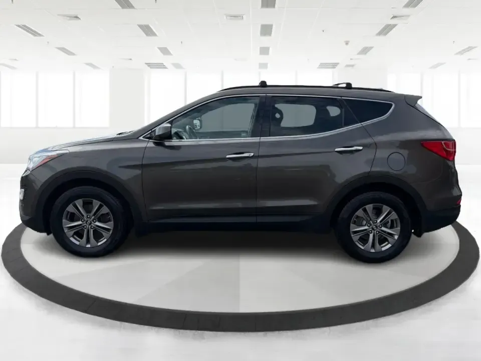 2014 Hyundai Santa Fe Sport 2.4 AWD (5XYZUDLB0EG) with an 2.4L L4 DOHC 16V engine, 6-Speed Automatic transmission, located at 4508 South Dixie Dr, Moraine, OH, 45439, (937) 908-9800, 39.689976, -84.218452 - Picture your next weekend escape: loading up the family, pointing the nose toward the MetroParks, and cruising I-75 with room for everyone and everything-without feeling like you're driving a bus. This 2014 Hyundai Santa Fe 2.4L in Cabo Bronze is a practical, road-trip-ready SUV that fits real life- Photo#5