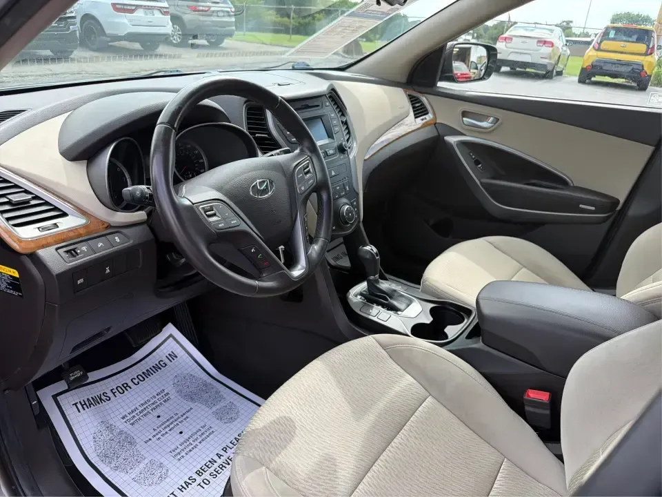 2014 Hyundai Santa Fe Sport 2.4 AWD (5XYZUDLB0EG) with an 2.4L L4 DOHC 16V engine, 6-Speed Automatic transmission, located at 4508 South Dixie Dr, Moraine, OH, 45439, (937) 908-9800, 39.689976, -84.218452 - Picture your next weekend escape: loading up the family, pointing the nose toward the MetroParks, and cruising I-75 with room for everyone and everything-without feeling like you're driving a bus. This 2014 Hyundai Santa Fe 2.4L in Cabo Bronze is a practical, road-trip-ready SUV that fits real life- Photo#9