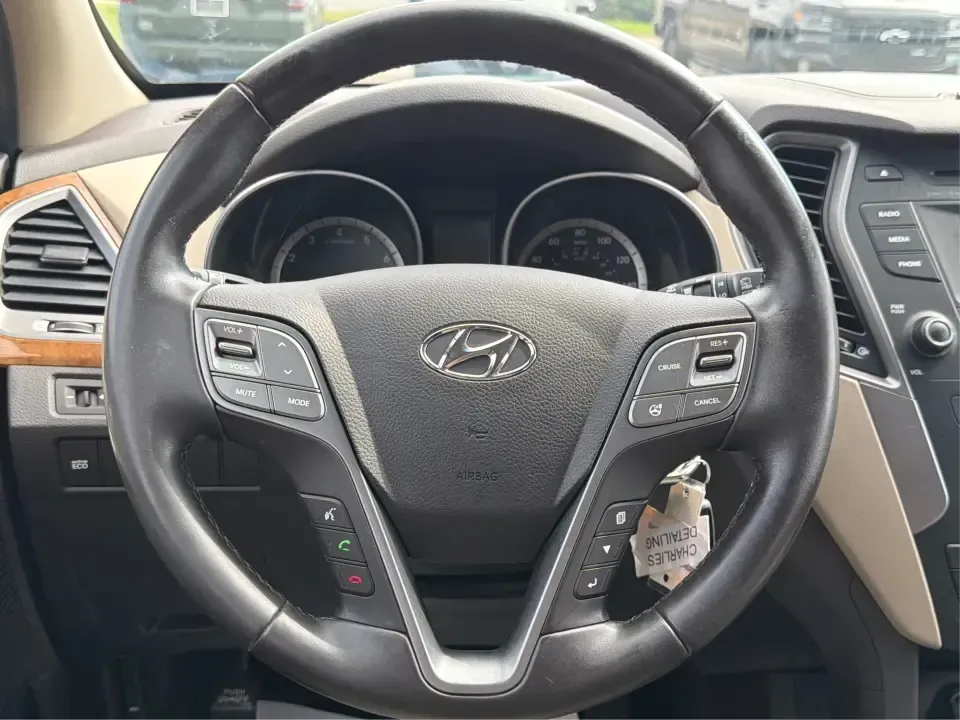 2014 Hyundai Santa Fe Sport 2.4 AWD (5XYZUDLB0EG) with an 2.4L L4 DOHC 16V engine, 6-Speed Automatic transmission, located at 4508 South Dixie Dr, Moraine, OH, 45439, (937) 908-9800, 39.689976, -84.218452 - Picture your next weekend escape: loading up the family, pointing the nose toward the MetroParks, and cruising I-75 with room for everyone and everything-without feeling like you're driving a bus. This 2014 Hyundai Santa Fe 2.4L in Cabo Bronze is a practical, road-trip-ready SUV that fits real life- Photo#16
