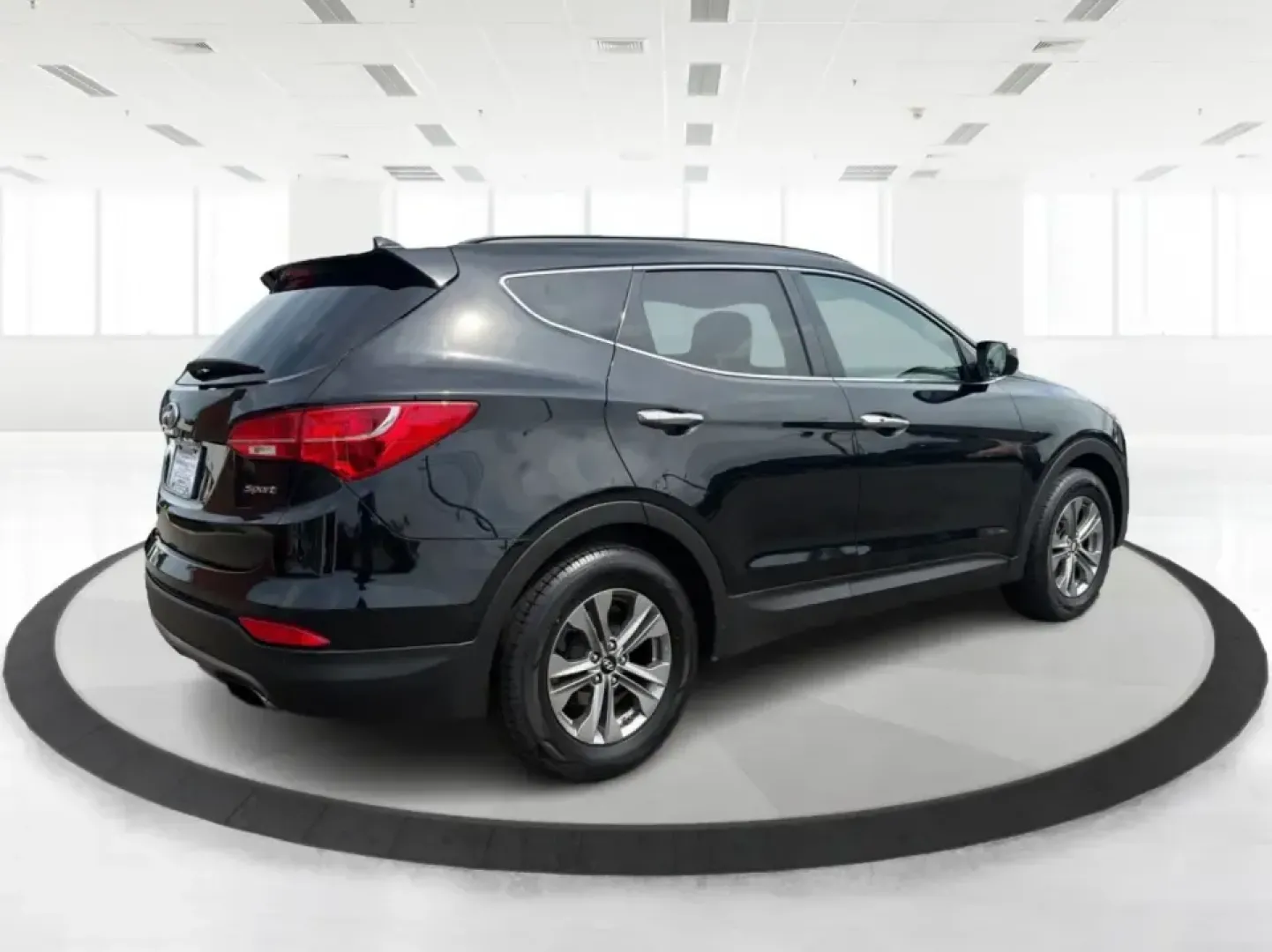 2016 Hyundai Santa Fe 2.4L (5XYZU3LB5GG) with an Theta II 2.4L I-4 gasoline direct injection engine, 6-Speed Automatic transmission, located at 1099 N County Rd 25A, Troy, OH, 45373, (937) 908-9800, 40.057079, -84.212883 - Load up the family, point the hood toward a weekend at John Bryan State Park, or make the daily commute from Xenia to Beavercreek feel more comfortable-this 2016 Hyundai Santa Fe 2.4L is the kind of SUV that fits real life. With three-row versatility in a right-sized footprint, it's ideal for school- Photo#2