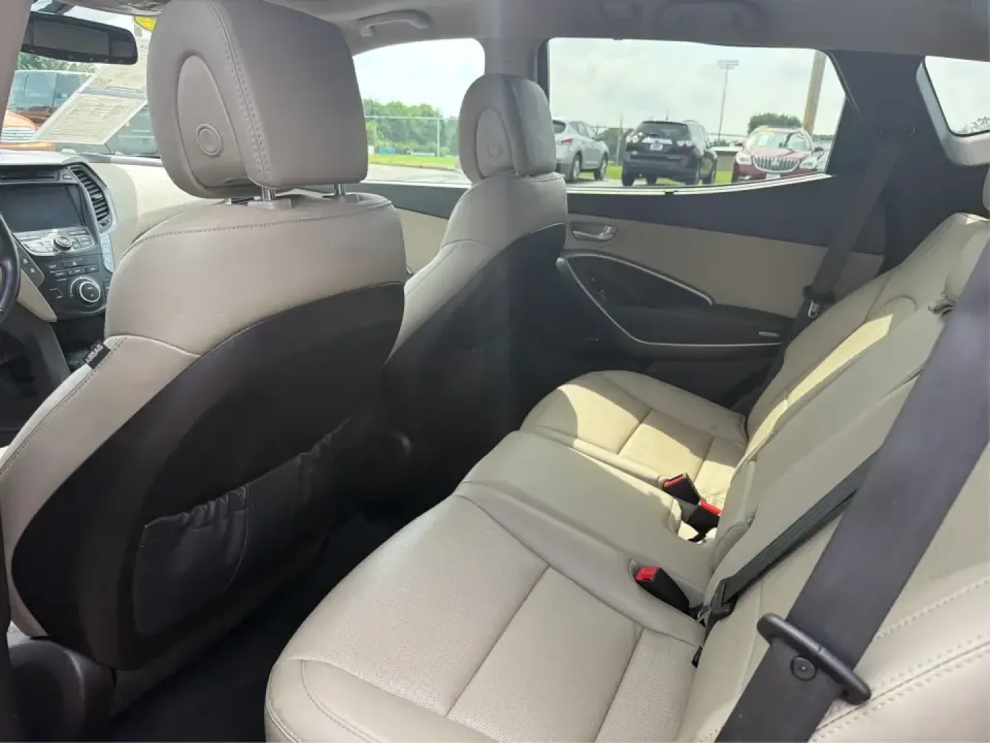 2016 Hyundai Santa Fe 2.4L (5XYZU3LB5GG) with an Theta II 2.4L I-4 gasoline direct injection engine, 6-Speed Automatic transmission, located at 1099 N County Rd 25A, Troy, OH, 45373, (937) 908-9800, 40.057079, -84.212883 - Load up the family, point the hood toward a weekend at John Bryan State Park, or make the daily commute from Xenia to Beavercreek feel more comfortable-this 2016 Hyundai Santa Fe 2.4L is the kind of SUV that fits real life. With three-row versatility in a right-sized footprint, it's ideal for school- Photo#10
