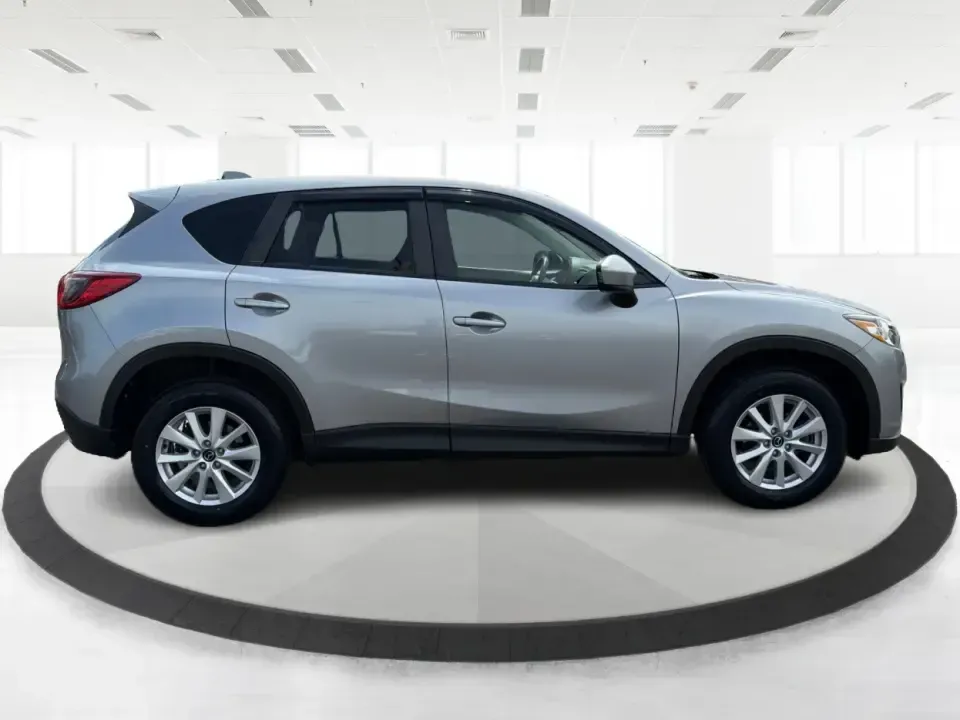 2014 Mazda CX-5 Touring (JM3KE2CYXE0) with an SKYACTIV-G 2.5L I-4 gasoline direct injection engine, 6-Speed Automatic transmission, located at 401 Woodman Dr, Riverside, OH, 45431, (937) 908-9800, 39.760899, -84.123421 - Need one SUV that can handle the weekday commute, Saturday errands, and a spontaneous road trip to John Bryan State Park without feeling like a chore? This 2014 Mazda CX-5 Touring in Liquid Silver Metallic is a smart, practical crossover for drivers who want real-world versatility, comfortable seati - Photo#1