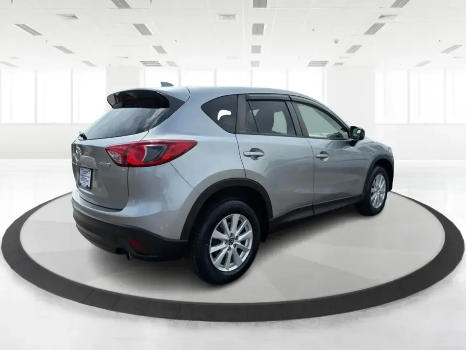 2014 Mazda CX-5 Touring (JM3KE2CYXE0) with an SKYACTIV-G 2.5L I-4 gasoline direct injection engine, 6-Speed Automatic transmission, located at 401 Woodman Dr, Riverside, OH, 45431, (937) 908-9800, 39.760899, -84.123421 - Need one SUV that can handle the weekday commute, Saturday errands, and a spontaneous road trip to John Bryan State Park without feeling like a chore? This 2014 Mazda CX-5 Touring in Liquid Silver Metallic is a smart, practical crossover for drivers who want real-world versatility, comfortable seati - Photo#2
