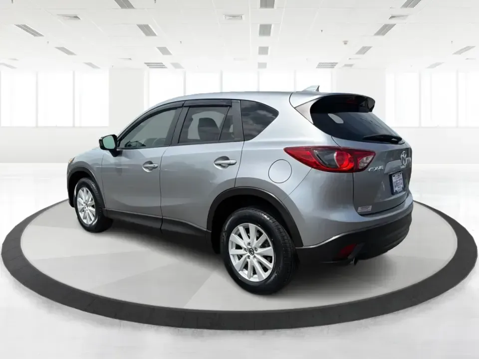 2014 Mazda CX-5 Touring (JM3KE2CYXE0) with an SKYACTIV-G 2.5L I-4 gasoline direct injection engine, 6-Speed Automatic transmission, located at 401 Woodman Dr, Riverside, OH, 45431, (937) 908-9800, 39.760899, -84.123421 - Need one SUV that can handle the weekday commute, Saturday errands, and a spontaneous road trip to John Bryan State Park without feeling like a chore? This 2014 Mazda CX-5 Touring in Liquid Silver Metallic is a smart, practical crossover for drivers who want real-world versatility, comfortable seati - Photo#4