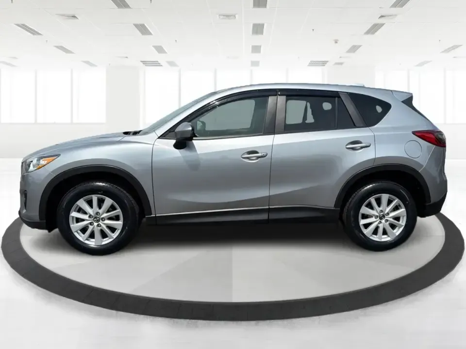 2014 Mazda CX-5 Touring (JM3KE2CYXE0) with an SKYACTIV-G 2.5L I-4 gasoline direct injection engine, 6-Speed Automatic transmission, located at 401 Woodman Dr, Riverside, OH, 45431, (937) 908-9800, 39.760899, -84.123421 - Need one SUV that can handle the weekday commute, Saturday errands, and a spontaneous road trip to John Bryan State Park without feeling like a chore? This 2014 Mazda CX-5 Touring in Liquid Silver Metallic is a smart, practical crossover for drivers who want real-world versatility, comfortable seati - Photo#5