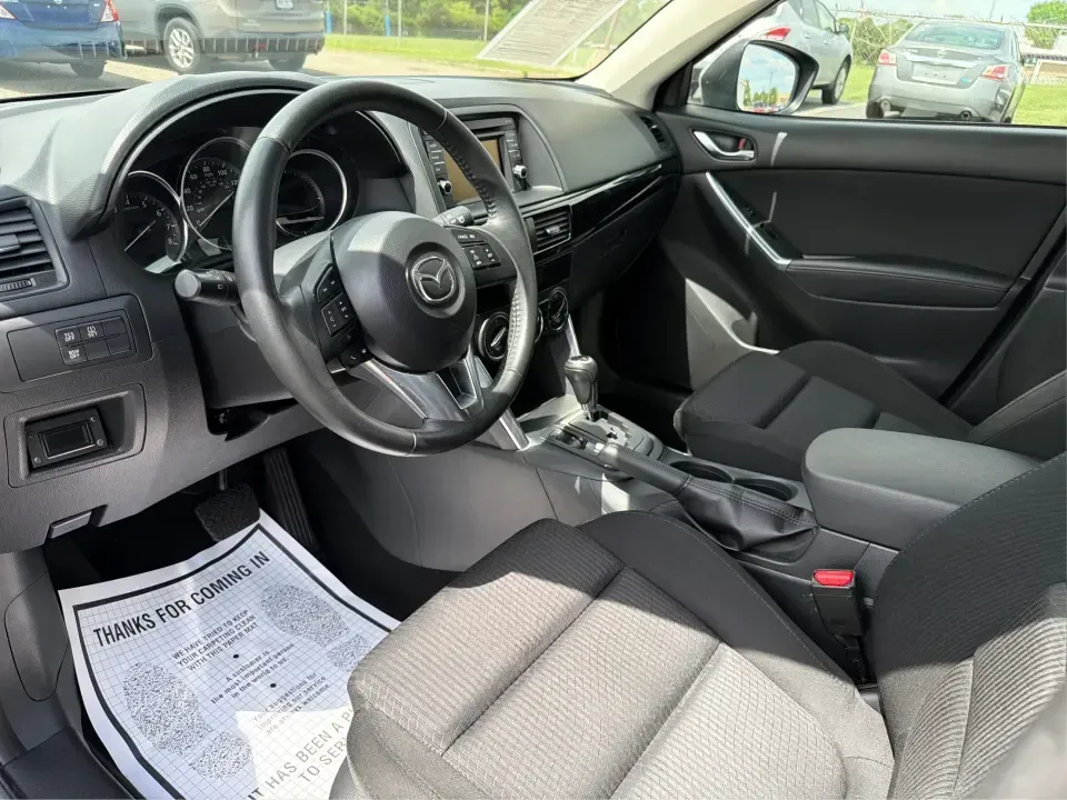 2014 Mazda CX-5 Touring (JM3KE2CYXE0) with an SKYACTIV-G 2.5L I-4 gasoline direct injection engine, 6-Speed Automatic transmission, located at 401 Woodman Dr, Riverside, OH, 45431, (937) 908-9800, 39.760899, -84.123421 - Need one SUV that can handle the weekday commute, Saturday errands, and a spontaneous road trip to John Bryan State Park without feeling like a chore? This 2014 Mazda CX-5 Touring in Liquid Silver Metallic is a smart, practical crossover for drivers who want real-world versatility, comfortable seati - Photo#9