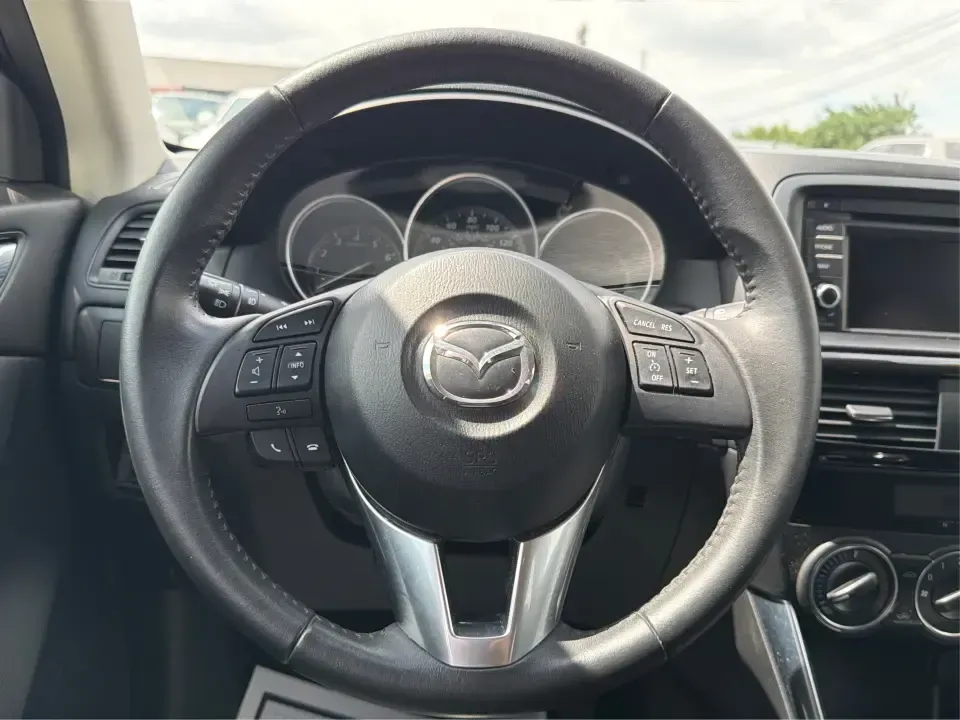 2014 Mazda CX-5 Touring (JM3KE2CYXE0) with an SKYACTIV-G 2.5L I-4 gasoline direct injection engine, 6-Speed Automatic transmission, located at 401 Woodman Dr, Riverside, OH, 45431, (937) 908-9800, 39.760899, -84.123421 - Need one SUV that can handle the weekday commute, Saturday errands, and a spontaneous road trip to John Bryan State Park without feeling like a chore? This 2014 Mazda CX-5 Touring in Liquid Silver Metallic is a smart, practical crossover for drivers who want real-world versatility, comfortable seati - Photo#16