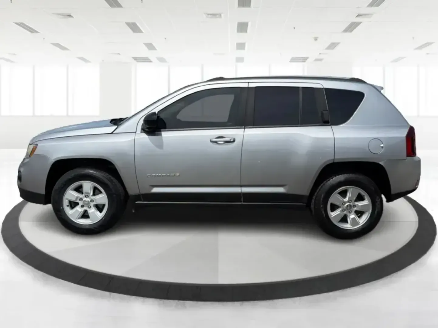 2015 Jeep Compass Sport FWD (1C4NJCBA6FD) with an 2.0L L4 DOHC 16V engine, located at 1951 S Dayton Lakeview Rd., New Carlisle, OH, 45344, (937) 908-9800, 39.890999, -84.050255 - Whether your week looks like a daily commute down I70, school drop-offs around Clark County, or a quick weekend escape to Buck Creek State Park, this **2015 Jeep Compass Sport FWD** is the kind of compact SUV that fits real life. With seating for **five**, easy-to-park sizing, and the versatile carg - Photo#5