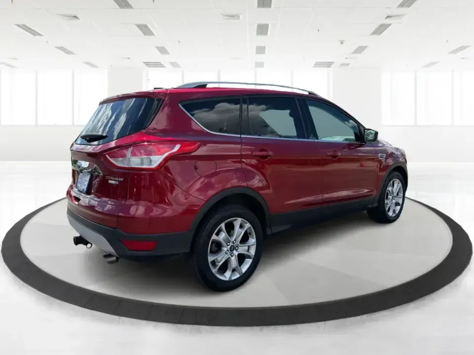 2014 Ford Escape Titanium 4WD (1FMCU9J91EU) with an 2.0L L4 DOHC 16V engine, 6-Speed Automatic transmission, located at 1099 N County Rd 25A, Troy, OH, 45373, (937) 908-9800, 40.057079, -84.212883 - Weekend getaways to Hocking Hills, snowy commutes up I75, or the everyday school-and-grocery loop around Troy-this 2014 Ford Escape Titanium 4WD is built for the kind of life that doesn't slow down when the weather changes. With seating for five, flexible cargo space, and confident four-wheel drive,- Photo#2