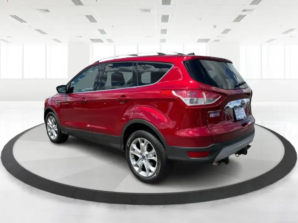 2014 Ford Escape Titanium 4WD (1FMCU9J91EU) with an 2.0L L4 DOHC 16V engine, 6-Speed Automatic transmission, located at 1099 N County Rd 25A, Troy, OH, 45373, (937) 908-9800, 40.057079, -84.212883 - Weekend getaways to Hocking Hills, snowy commutes up I75, or the everyday school-and-grocery loop around Troy-this 2014 Ford Escape Titanium 4WD is built for the kind of life that doesn't slow down when the weather changes. With seating for five, flexible cargo space, and confident four-wheel drive,- Photo#4
